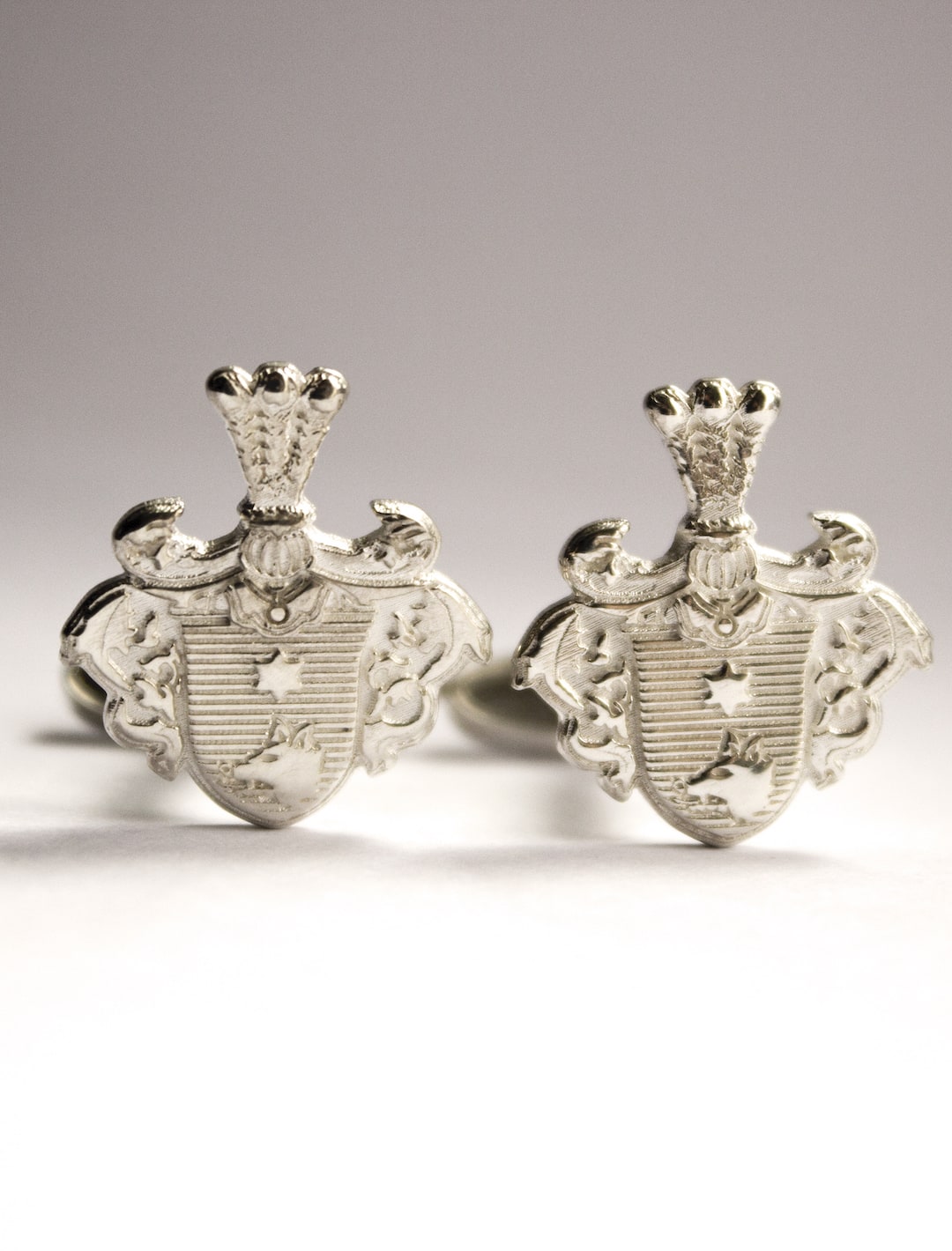 Silver cufflinks coat of arms